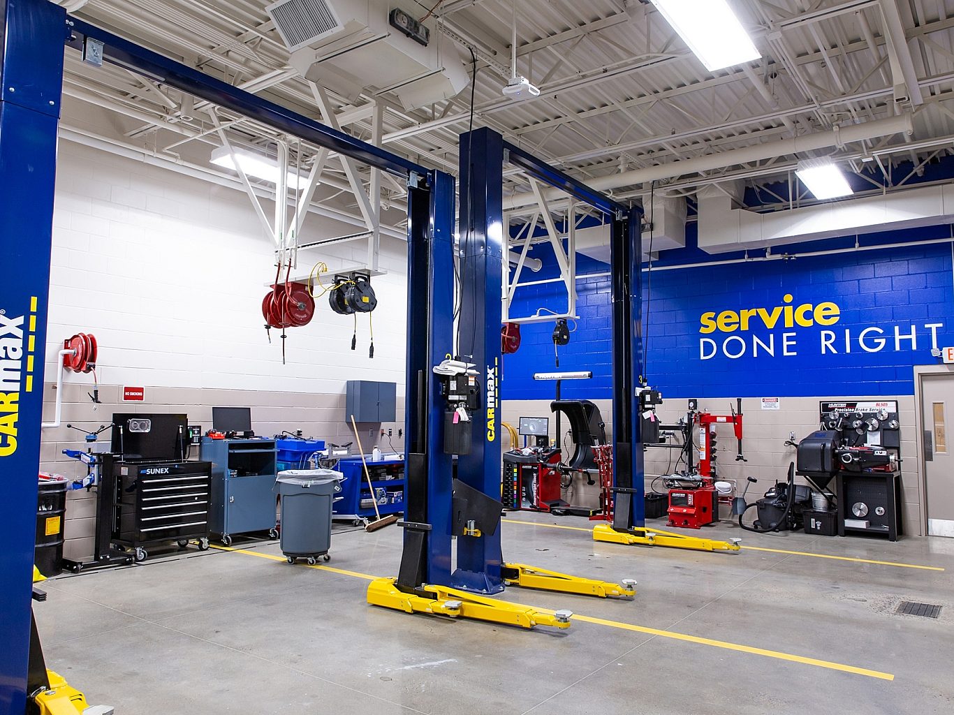 The auto mechanic shop in a CarMax dealership with 3 bays.