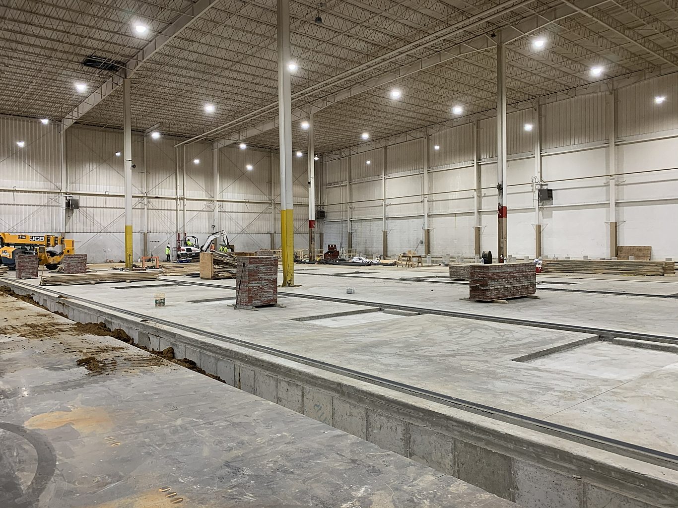 The stone foundation of a building under construction.
