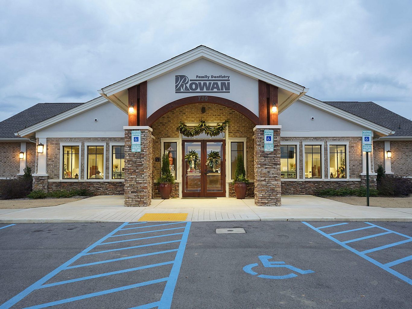 The exterior of a family dental office with an empty parking lot.