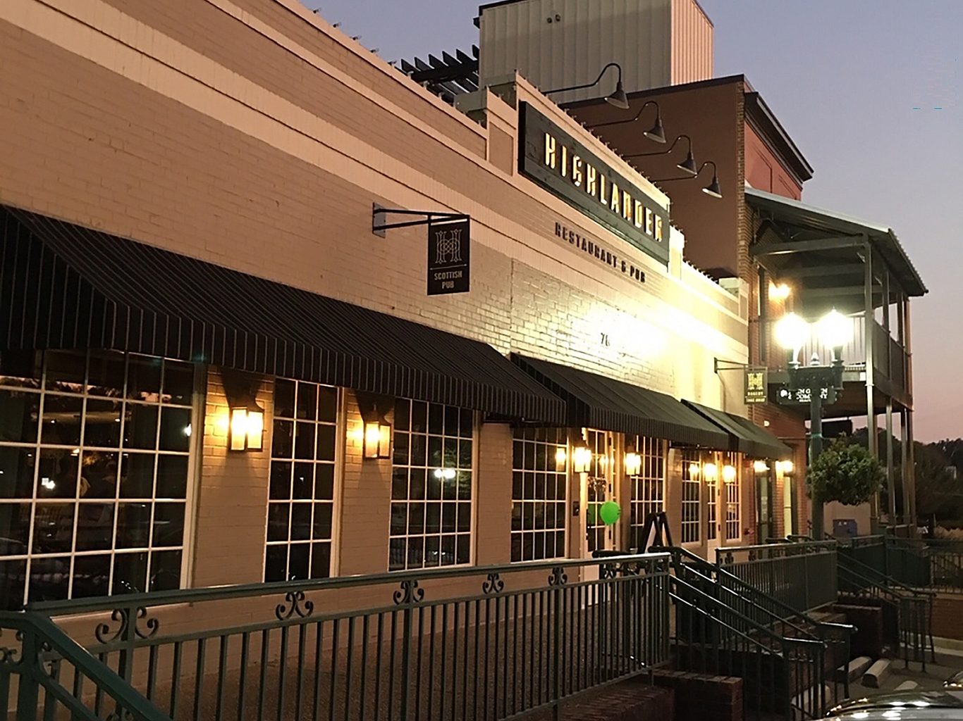 Exterior view of a pub at dusk