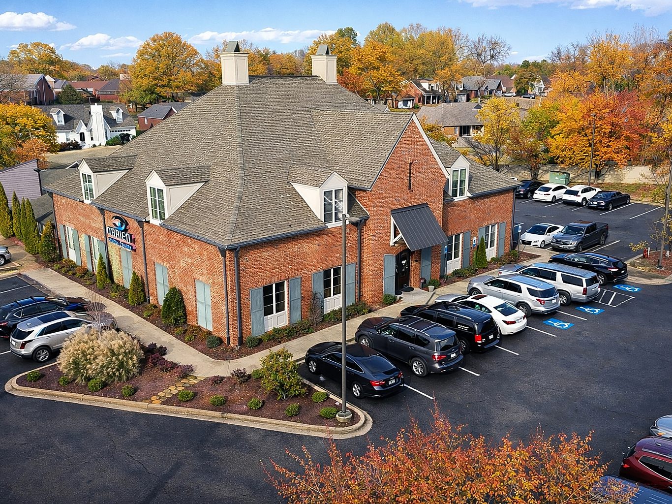Aerial view of an optometrist's office with cars in the parking lot