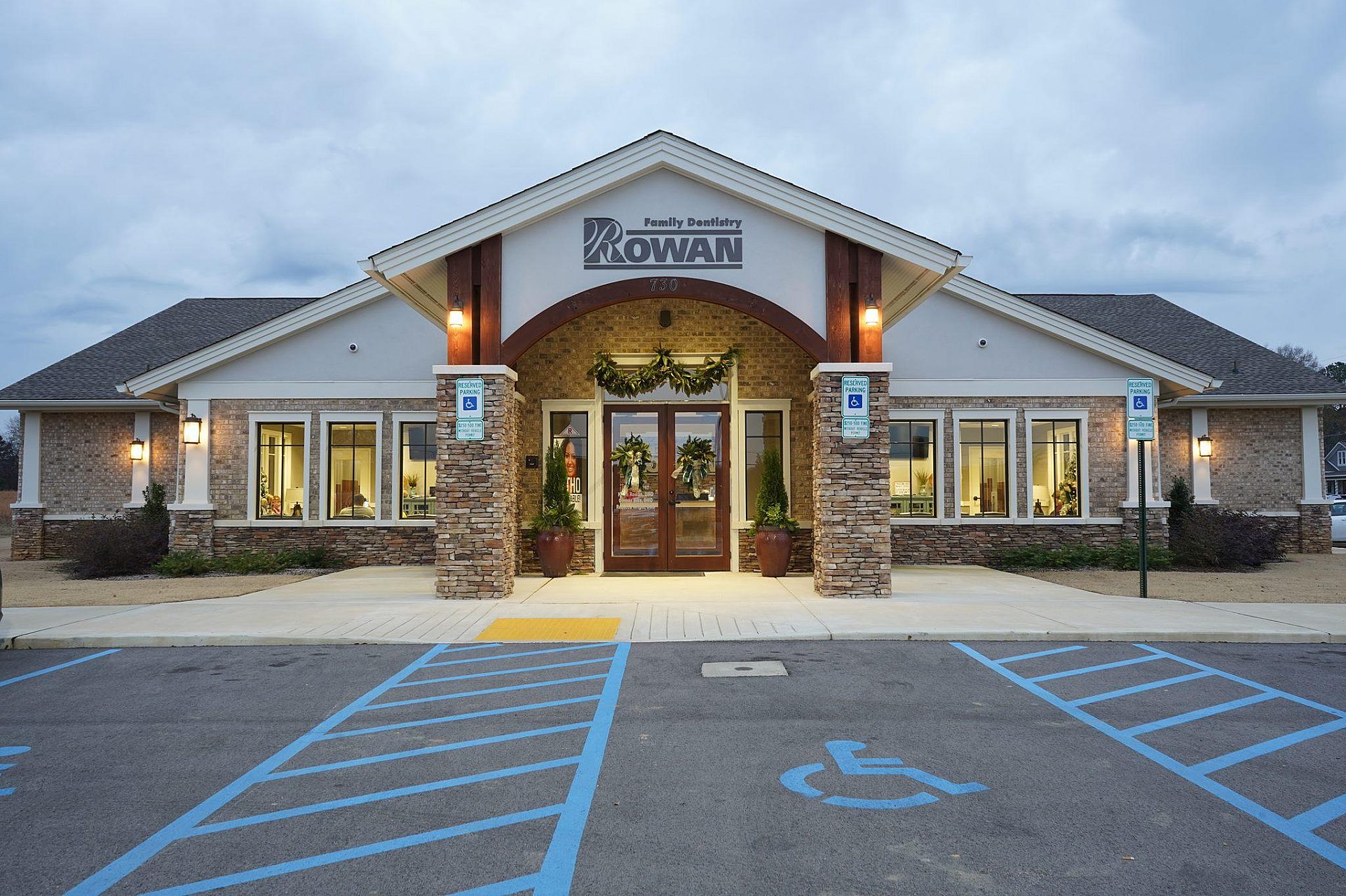The exterior of a family dental office with an empty parking lot.
