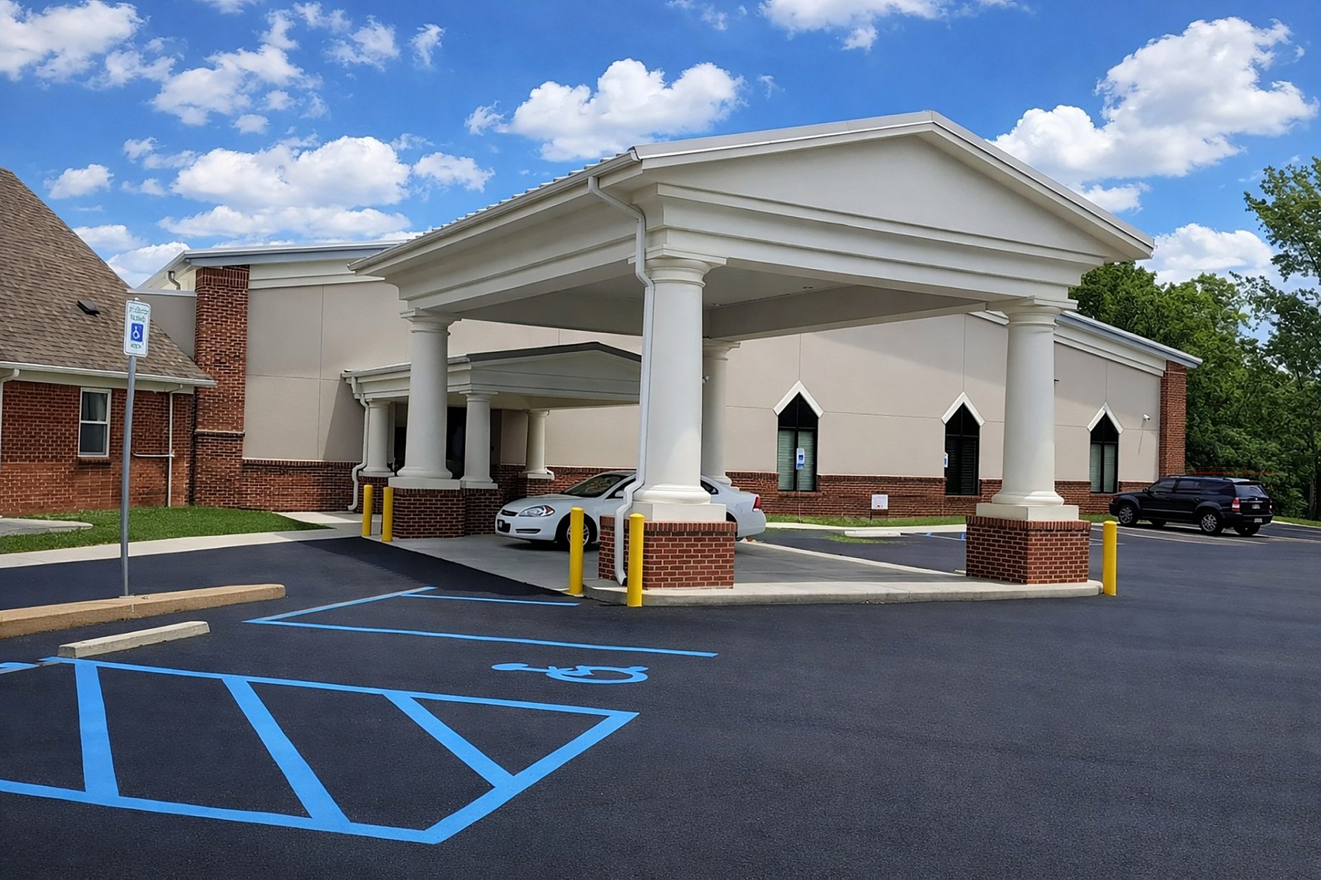 The entrance to a church building featuring a covered area in case of rain.