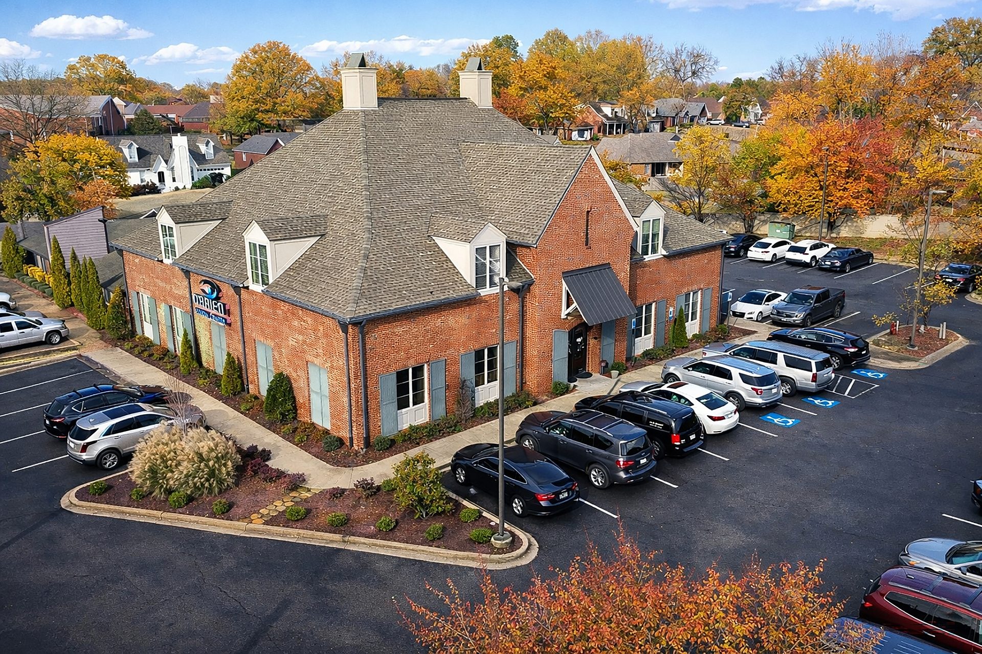 Aerial view of an optometrist's office with cars in the parking lot