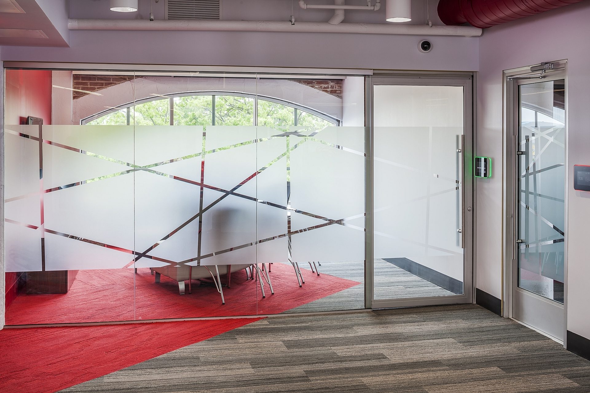 Glazed glass on the wall of a meeting room.