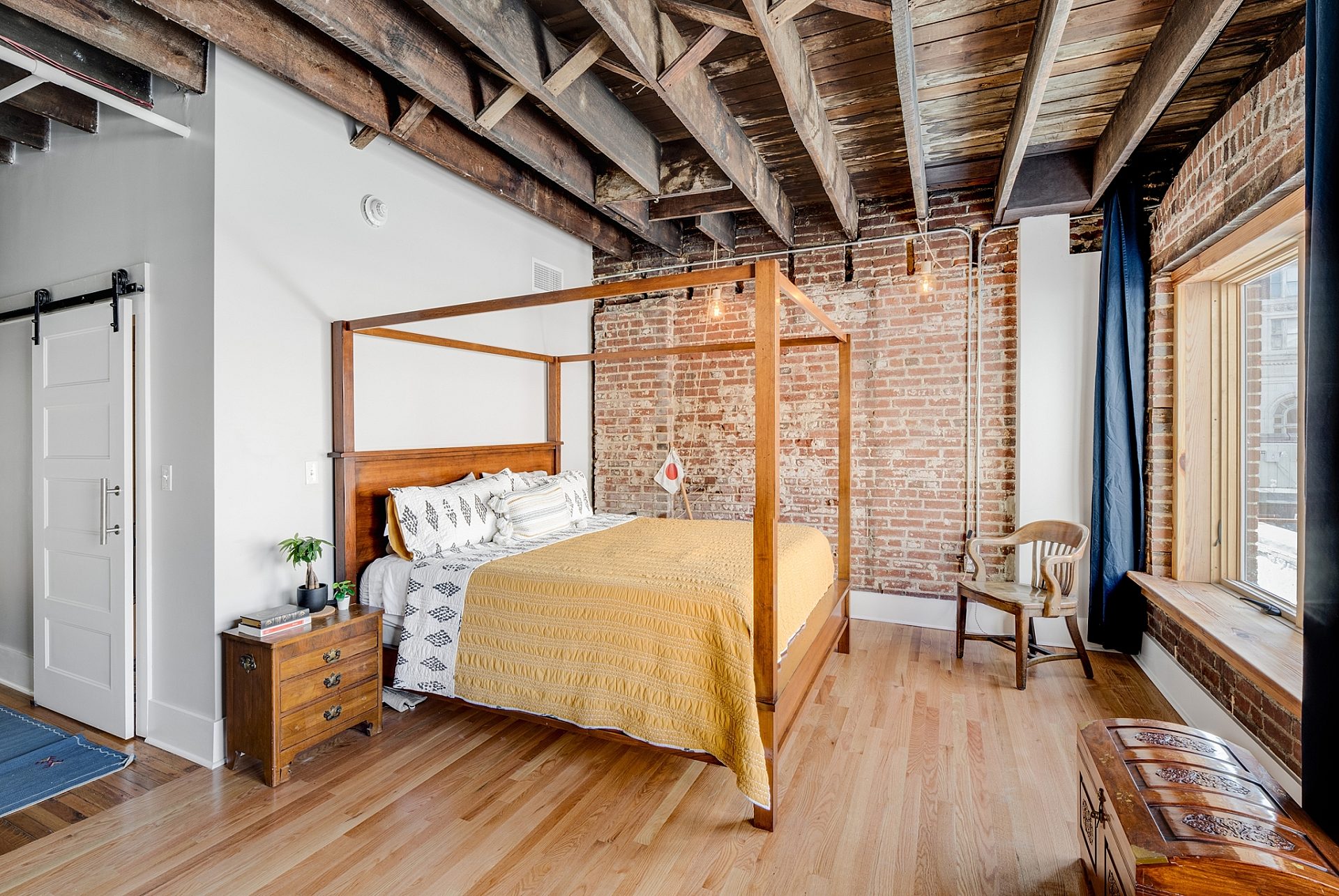 The bedroom in a modern apartment with an industrial style