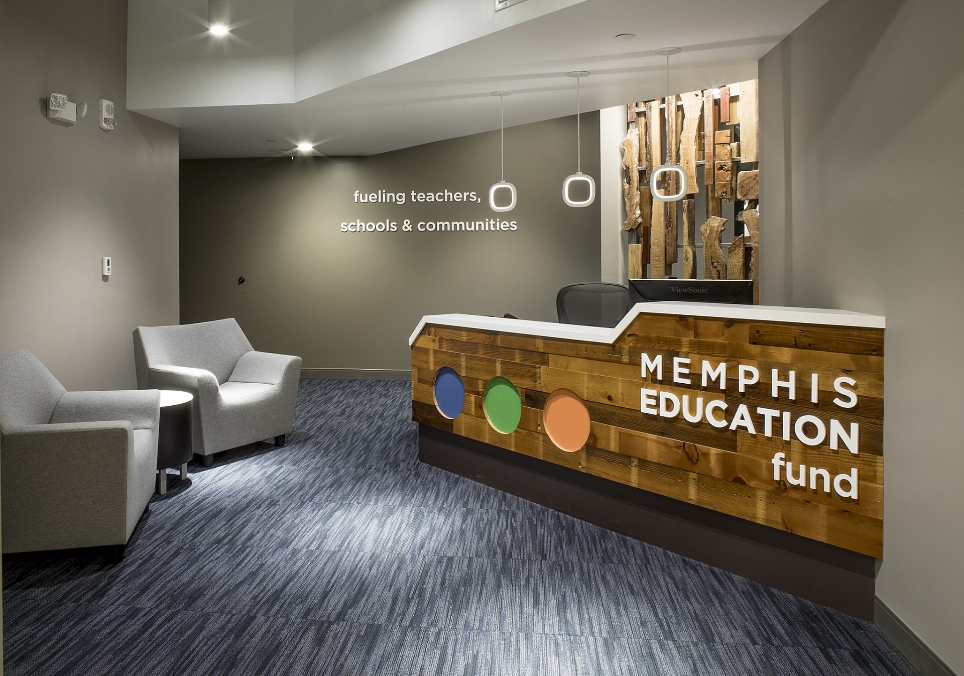 The entrance to the Memphis Education Fund. A receptionist's desk is on the right, and two chairs in the waiting room on the left.