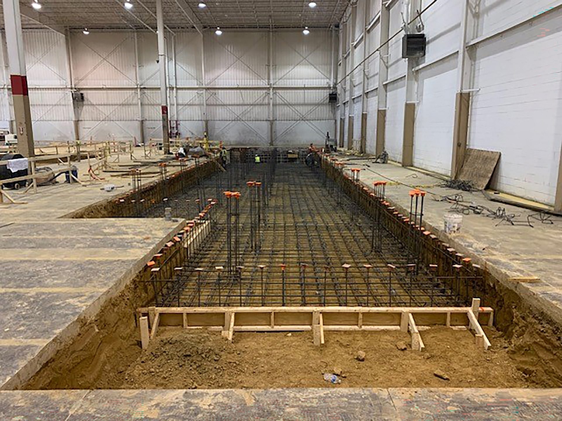 The iron framework of a foundation for an industrial building.