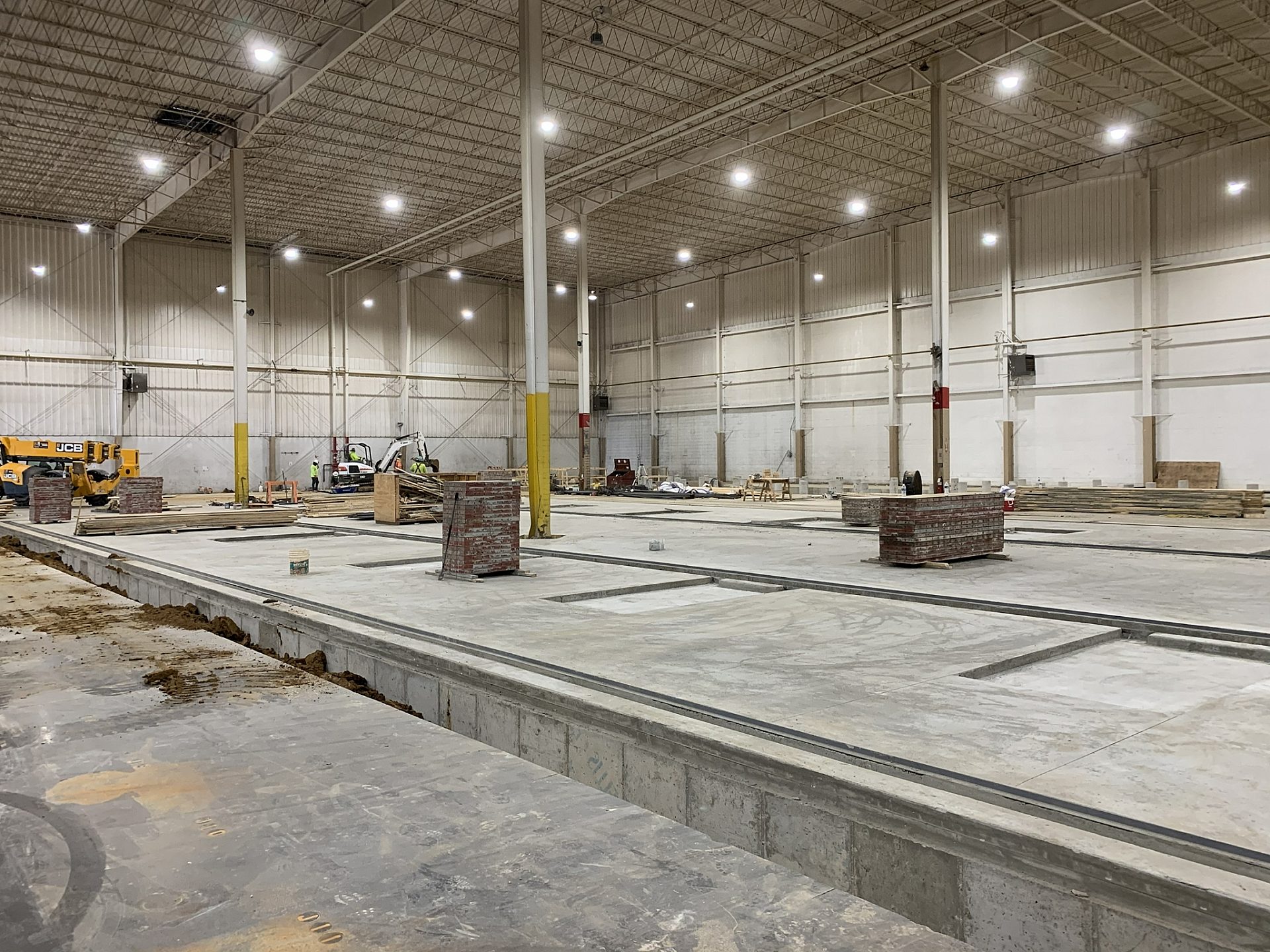 The stone foundation of a building under construction.