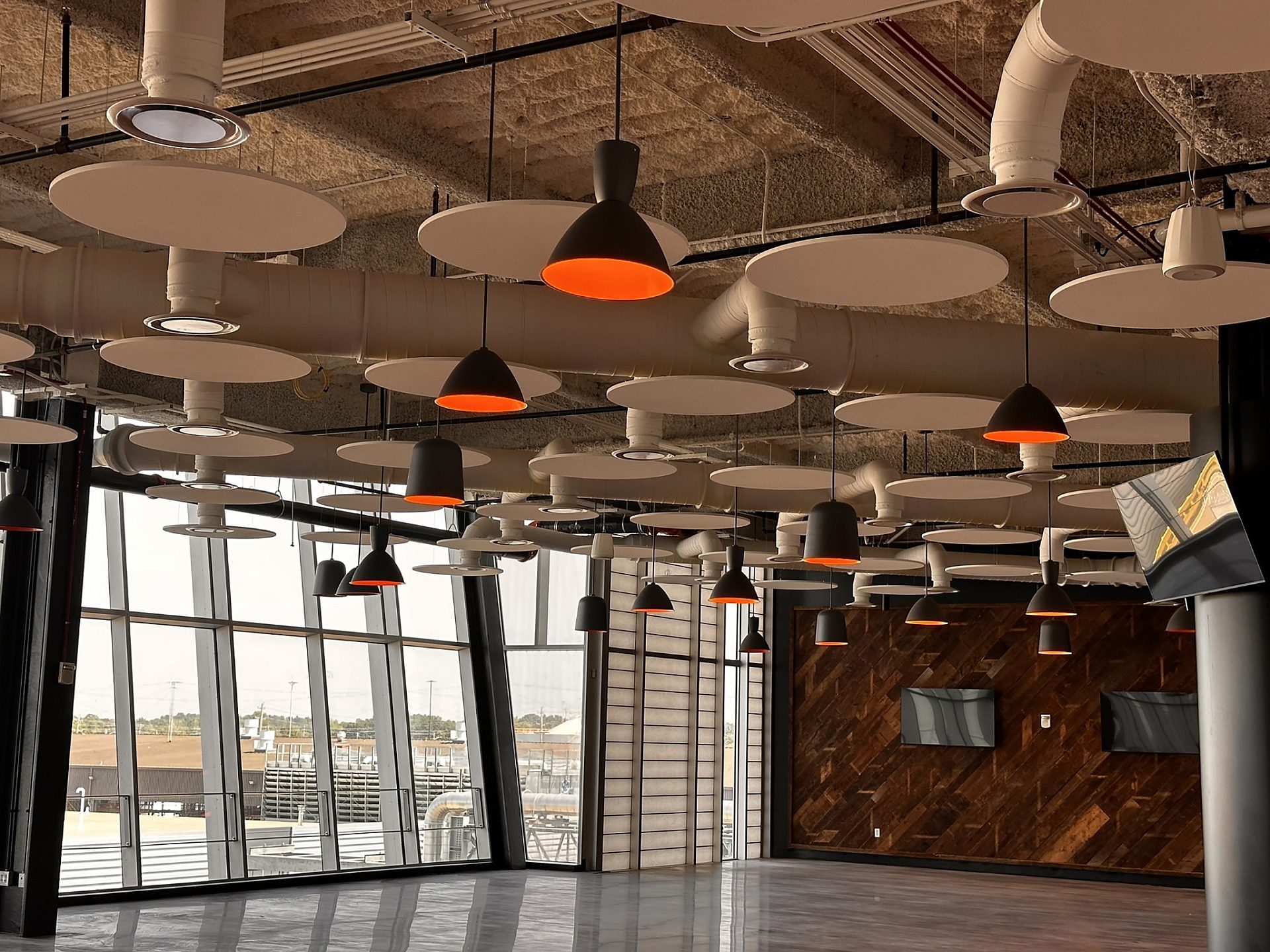 An open space with floor to ceiling windows.