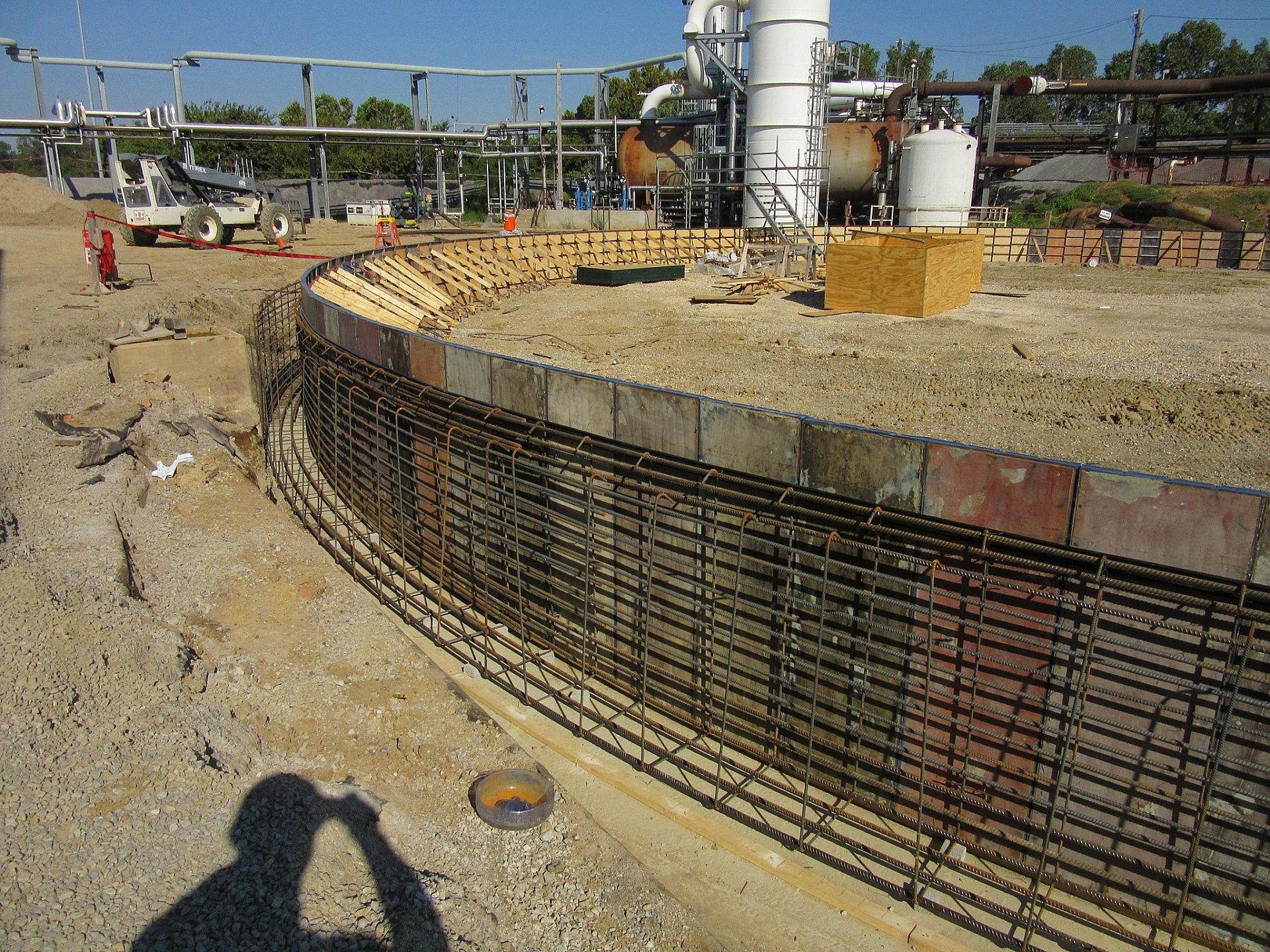 A construction site with an iron framework supporting the foundation
