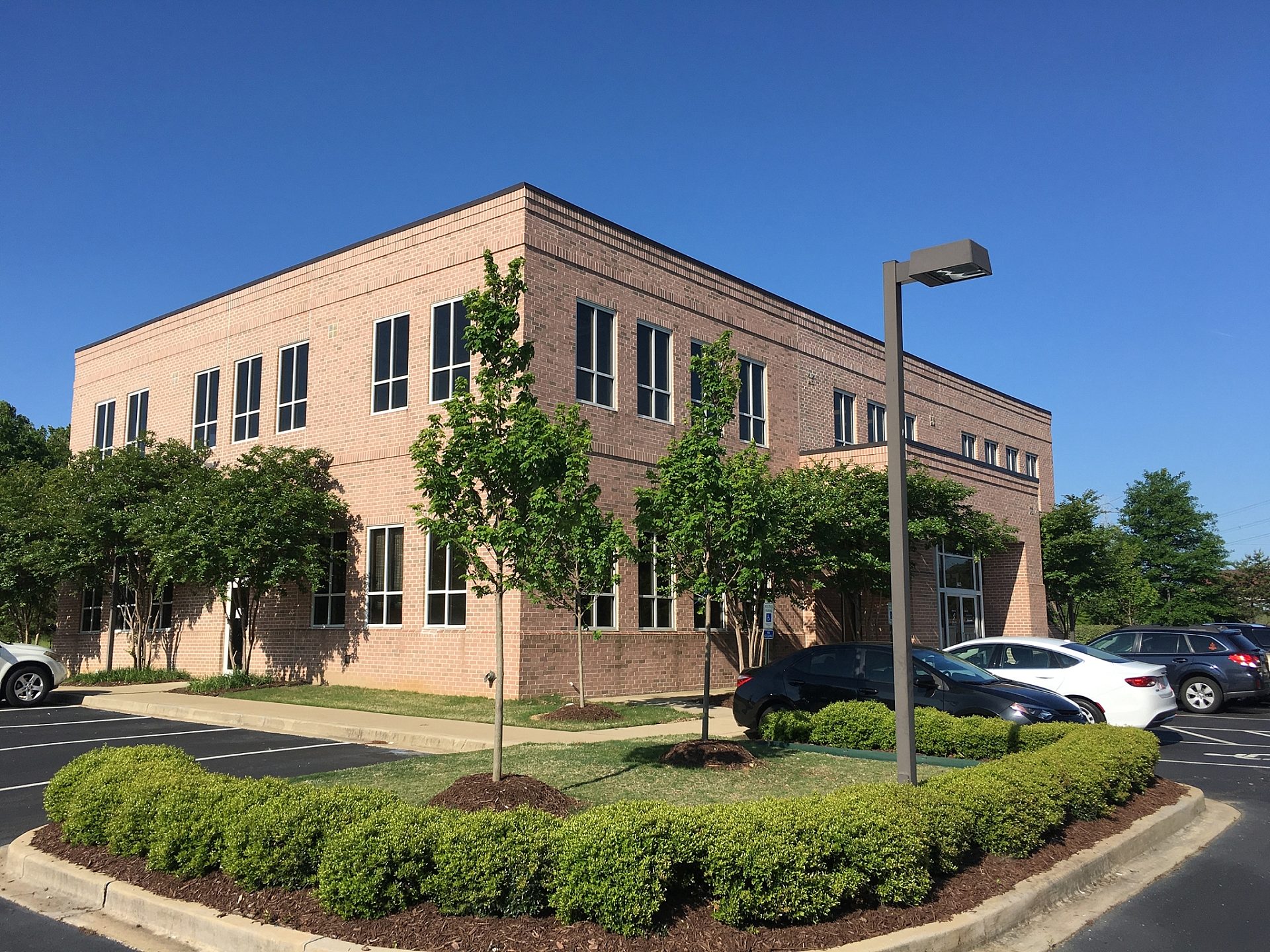 The exterior of a brick office building.