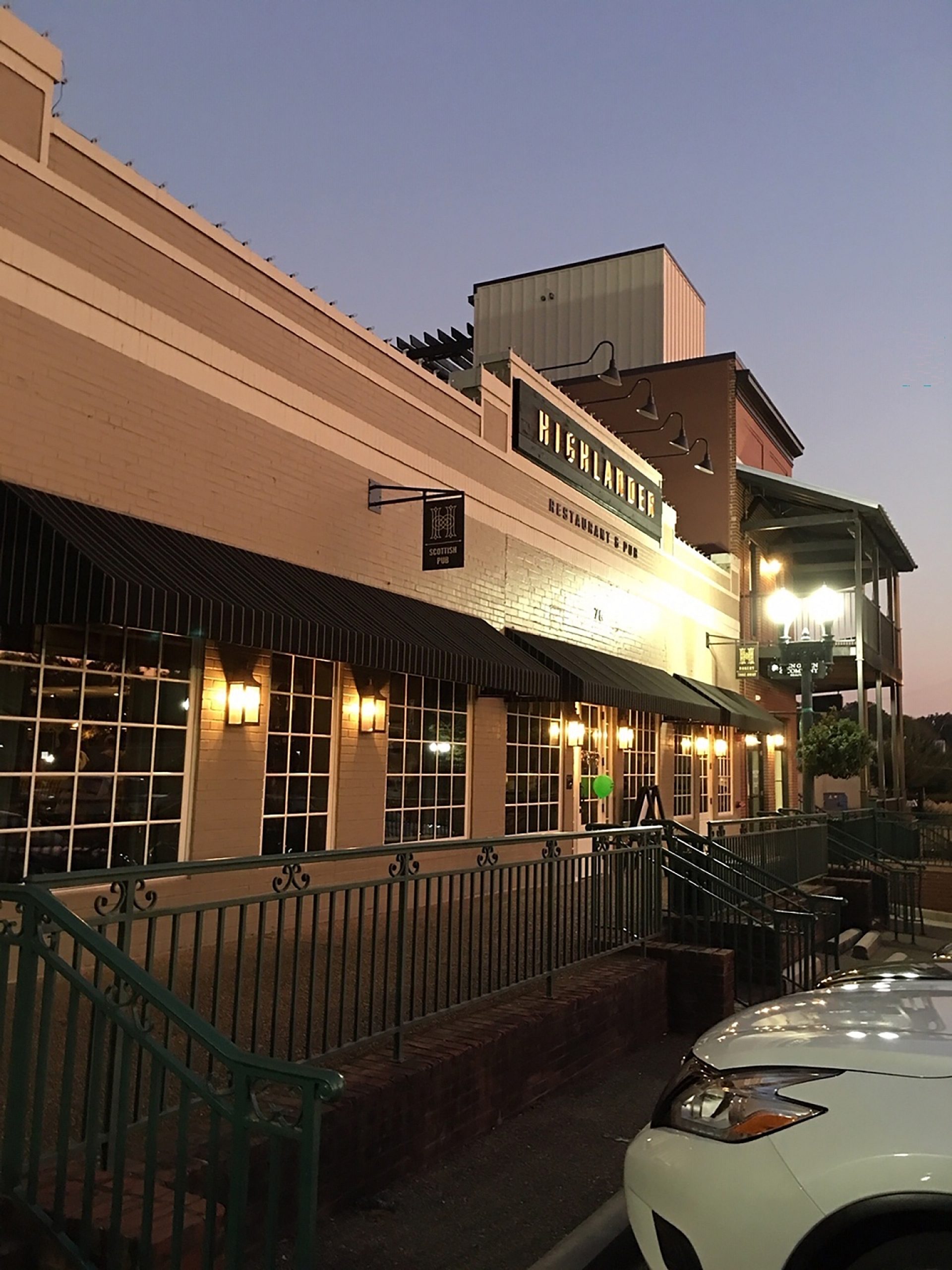 Exterior view of a pub at dusk