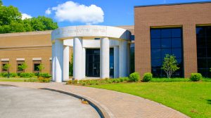 The entrance to a community rec center. A circular structure with columns supporting it is at the entrance with "Bartlett Recreation Center" written across the top.