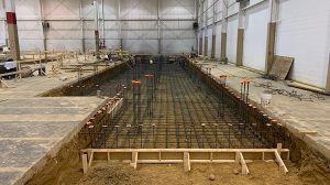 The iron framework of a foundation for an industrial building.