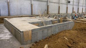 The floor of an industrial building under construction.