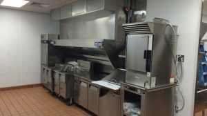Appliances in the kitchen of a fast food restaurant.