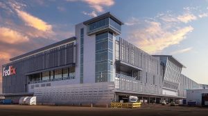 The exterior of Fedex's sorting facility at sunset.