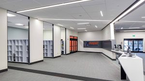 The interior of an office with several rooms containing on the storage on the left.