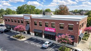 The exterior view of InSouth Bank next to a T-Mobile.
