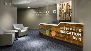 The entrance to the Memphis Education Fund. A receptionist's desk is on the right, and two chairs in the waiting room on the left.