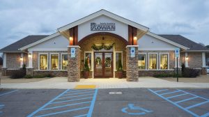 The exterior of a family dental office with an empty parking lot.