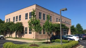 The exterior of a brick office building.