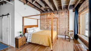 The bedroom in a modern apartment with an industrial style
