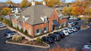 Aerial view of an optometrist's office with cars in the parking lot