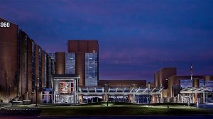 Entrance to a hospital building with a canopy to drive under at night